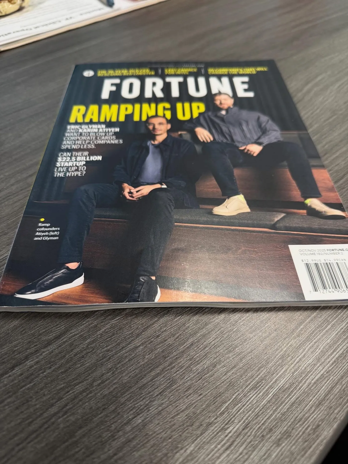 The cover of a Fortune magazine print issue lying on a wooden desk