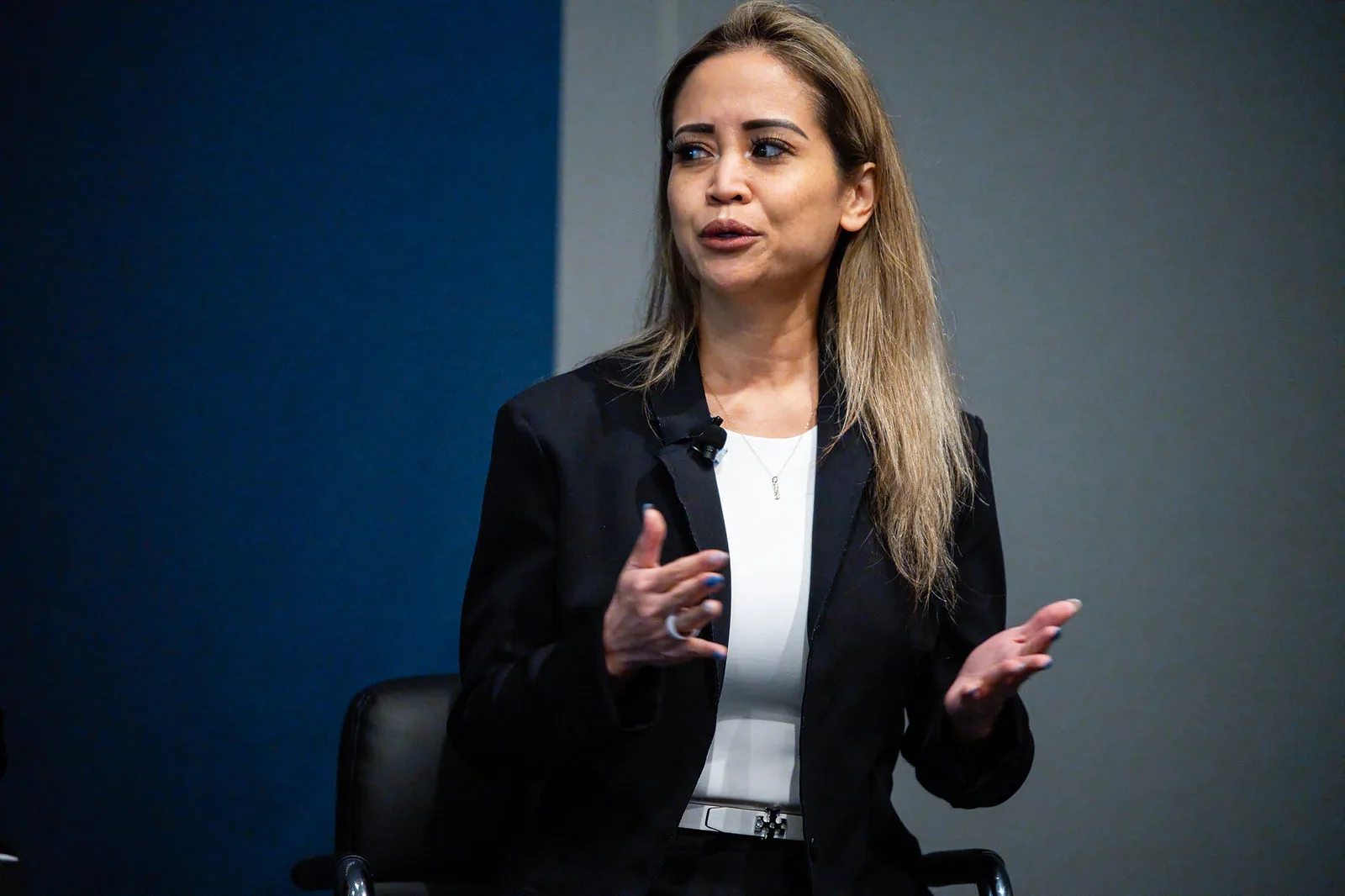 Monica D. Cutia, BSN, RN, PHN, COS-C speaking on stage at FUTURE in Austin